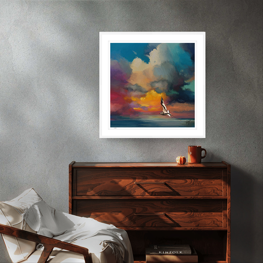 Golden Sunset wildlife art white framed limited edition print by Natalie Jump. A solitary seagull glides effortlessly across the surface of a calm, glass like sea.