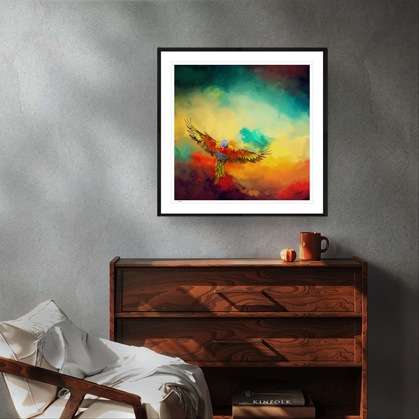 Lorikeets Flight wildlife black framed limited edition art print by Natalie Jump. A vibrant sky with swirling cloud like textures of red, yellow and green. In the foreground a lorikeet bursts into flight.