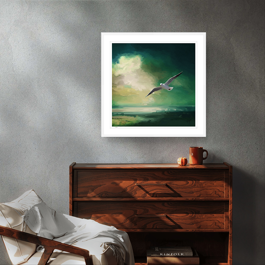 Glide wildlife art white framed limited edition print by Natalie Jump. A lone seagull glides effortlessly across a deep sea green sky. 