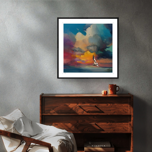 Golden Sunset wildlife art black framed limited edition print by Natalie Jump. A solitary seagull glides effortlessly across the surface of a calm, glass like sea.