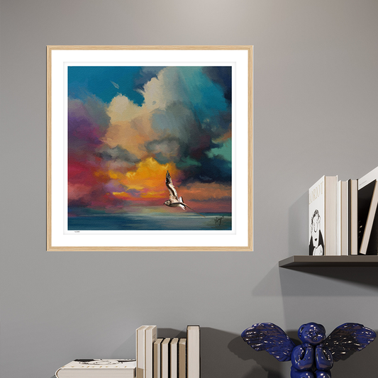 Golden Sunset wildlife art oak framed open edition print by Natalie Jump. A solitary seagull glides effortlessly across the surface of a calm, glass like sea.