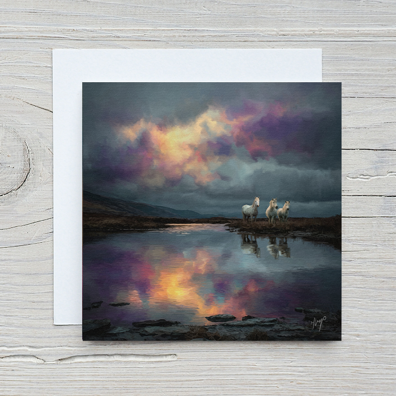 Long Mynd Ponies wildlife art greetings card by Natalie Jump. Three white ponies stand together on a hilltop infant of a stretch of water. Blank with a cream envelope.