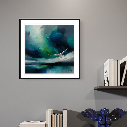 Seabird wildlife art black framed open edition print by Natalie Jump. A white seagull extends its powerful wings, cutting through a dramatic stormy sky. 