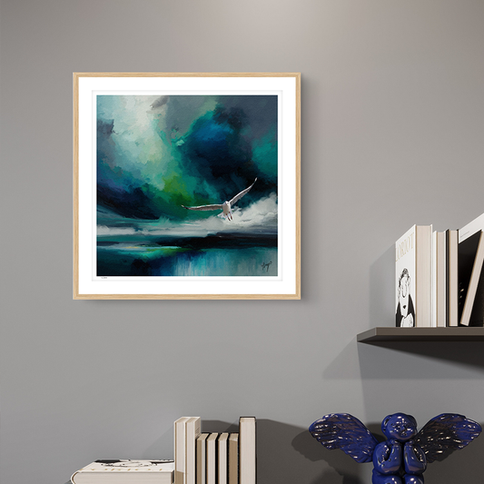 Seabird wildlife art oak framed open edition print by Natalie Jump. A white seagull extends its powerful wings, cutting through a dramatic stormy sky. 