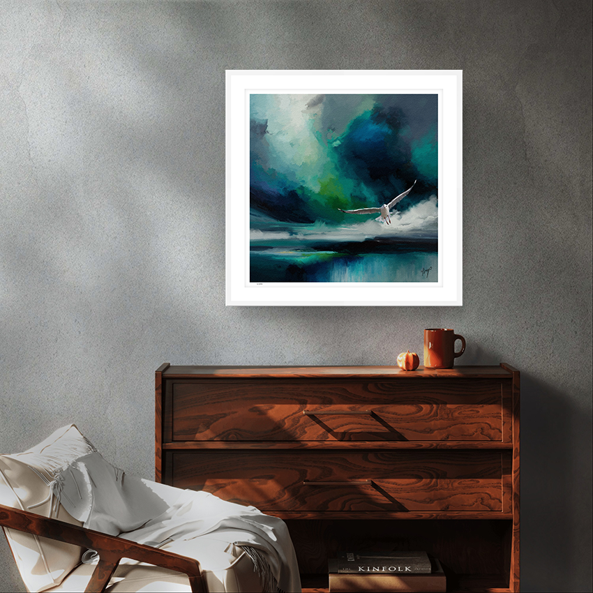 Seabird wildlife art white framed limited edition print by Natalie Jump. A white seagull extends its powerful wings, cutting through a dramatic stormy sky. 