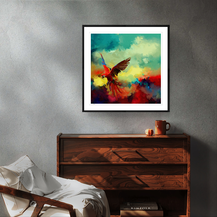 Tropical Drift wildlife black framed limited edition art print by Natalie Jump. A vibrant explosion of colour and motion, a macaw is captured mid-flight, its wings extended in a burst of reds, golds and electric blues. 
