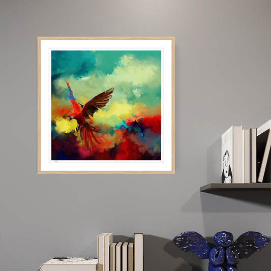 Tropical Drift wildlife art oak framed open edition print by Natalie Jump. A vibrant explosion of colour and motion, a macaw is captured mid-flight, its wings extended in a burst of reds, golds and electric blues. 
